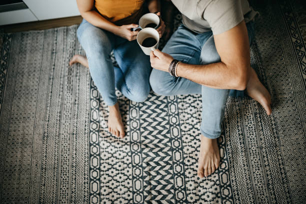 Couple enjoying coffee | Flooring By Design NC